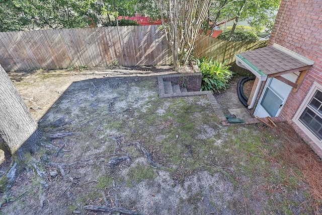 view of yard with a fenced backyard