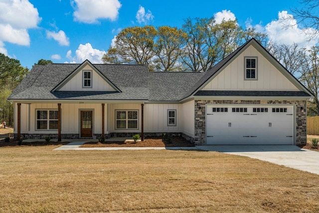 204 Lee Rd Unit 0334, Salem, AL 36874 - view of front of house featuring driveway, a front yard, stone siding, board and batten siding, and a shingled roof