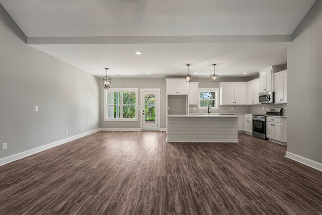 204 Lee Rd Unit 0334, Salem, AL 36874 - kitchen with baseboards, backsplash, appliances with stainless steel finishes, and dark wood-type flooring
