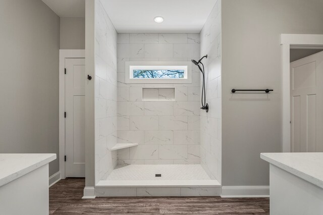 204 Lee Rd Unit 0334, Salem, AL 36874 - full bath with vanity, baseboards, a tile shower, and wood finished floors