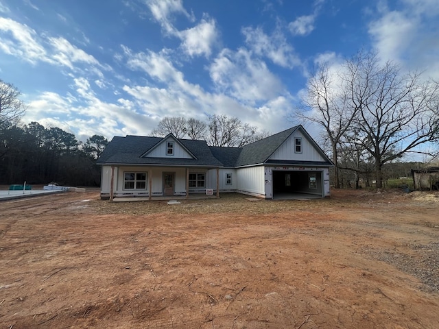204 Lee Rd Unit 0334, Salem, AL 36874 - view of front of home featuring dirt driveway, a porch, and a garage