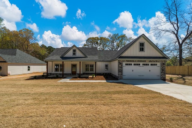 204 Lee Rd Unit 0334, Salem, AL 36874 - view of front of house featuring board and batten siding, concrete driveway, fence, and a front lawn