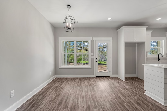204 Lee Rd Unit 0334, Salem, AL 36874 - unfurnished dining area with recessed lighting, an inviting chandelier, baseboards, a sink, and dark wood-style floors