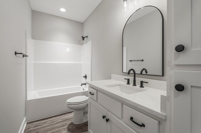 204 Lee Rd Unit 0334, Salem, AL 36874 - bathroom featuring tub / shower combination, toilet, vanity, and wood finished floors