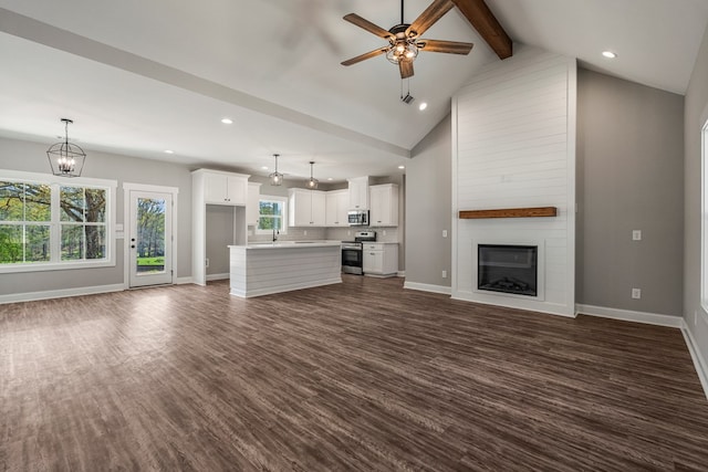 204 Lee Rd Unit 0334, Salem, AL 36874 - unfurnished living room featuring beam ceiling, a fireplace, dark wood finished floors, baseboards, and ceiling fan with notable chandelier