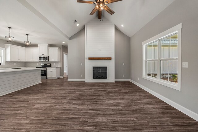 204 Lee Rd Unit 0334, Salem, AL 36874 - unfurnished living room featuring dark wood-type flooring, a large fireplace, baseboards, and a ceiling fan