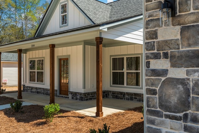204 Lee Rd Unit 0334, Salem, AL 36874 - view of property exterior featuring stone siding, board and batten siding, a porch, and roof with shingles