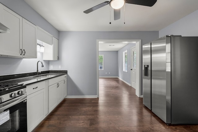 8344 Twin Chapel Dr, Columbus, GA 31904 - kitchen featuring appliances with stainless steel finishes, a sink, dark countertops, a ceiling fan, and dark wood-style floors