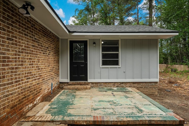 8344 Twin Chapel Dr, Columbus, GA 31904 - property entrance with a shingled roof, board and batten siding, and brick siding