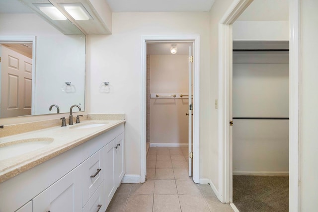 bathroom with tile patterned flooring and vanity