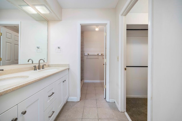 bathroom with tile patterned floors and vanity