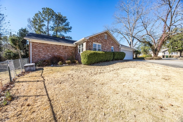 view of side of home featuring a garage