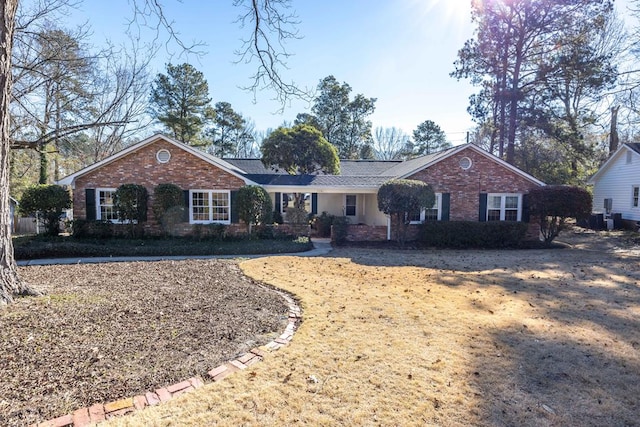 ranch-style house with a front lawn