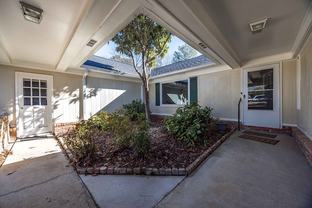 doorway to property with a patio area