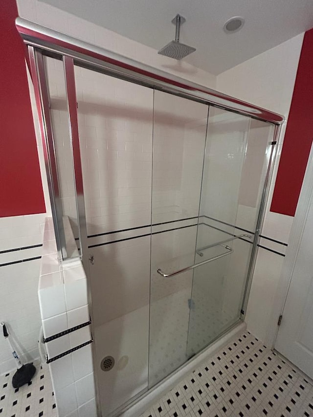 bathroom featuring tile patterned floors and walk in shower