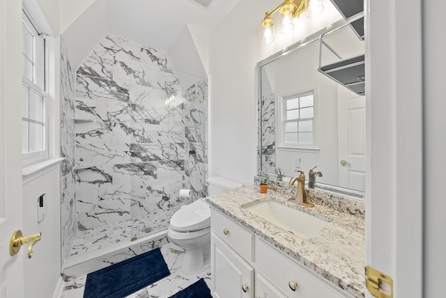 full bathroom with vanity, marble finish floor, toilet, and a shower stall