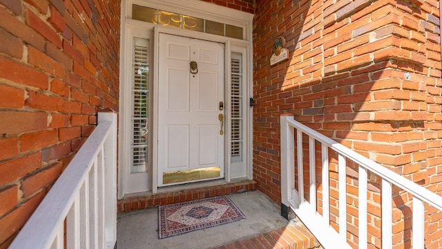 property entrance with brick siding