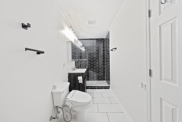 bathroom with vanity, toilet, ornamental molding, and a stall shower