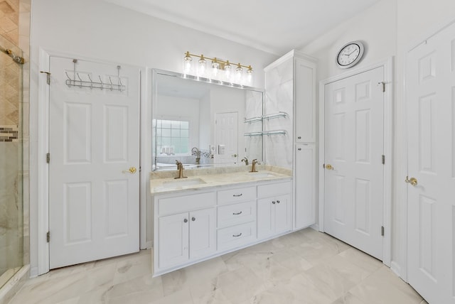 bathroom with double vanity, a sink, marble finish floor, and a stall shower
