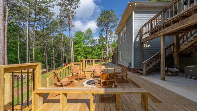 deck featuring stairs and central AC unit