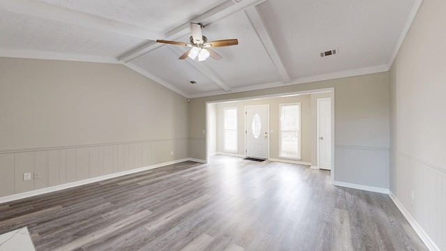 unfurnished room featuring vaulted ceiling with beams, a textured ceiling, wood-type flooring, and ceiling fan