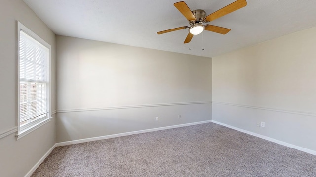 empty room with carpet and ceiling fan