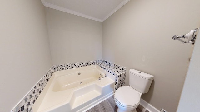 bathroom featuring ornamental molding, toilet, a bathtub, and wood-type flooring