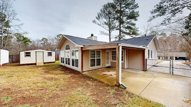 exterior space featuring a patio and a shed