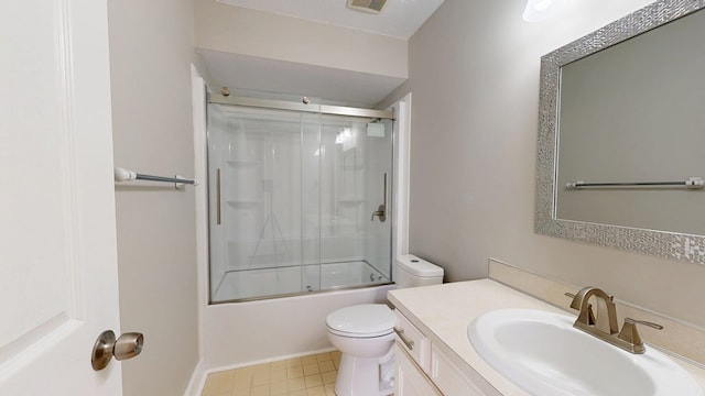 full bathroom with vanity, shower / bath combination with glass door, and toilet