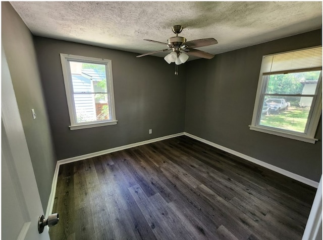 unfurnished room with dark wood-type flooring, ceiling fan, and a textured ceiling