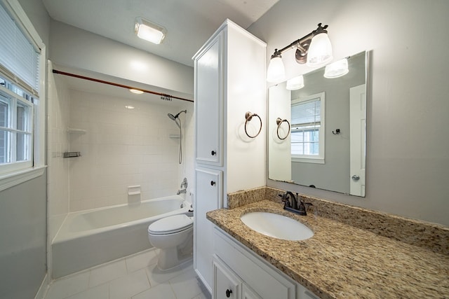 full bath featuring tile patterned flooring, toilet, vanity, and shower / bath combination