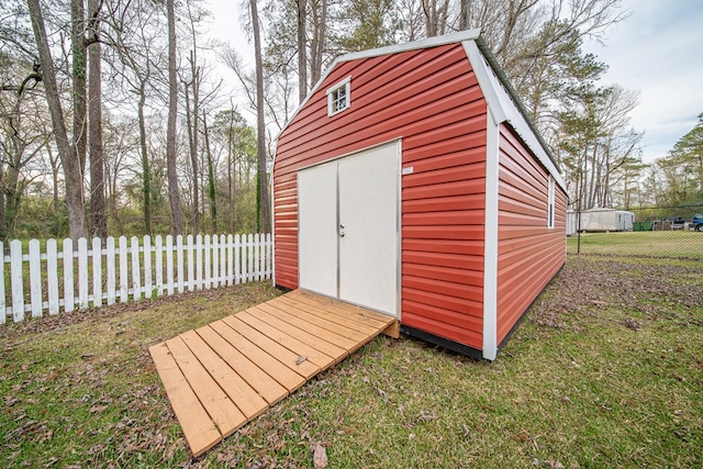 view of shed with fence