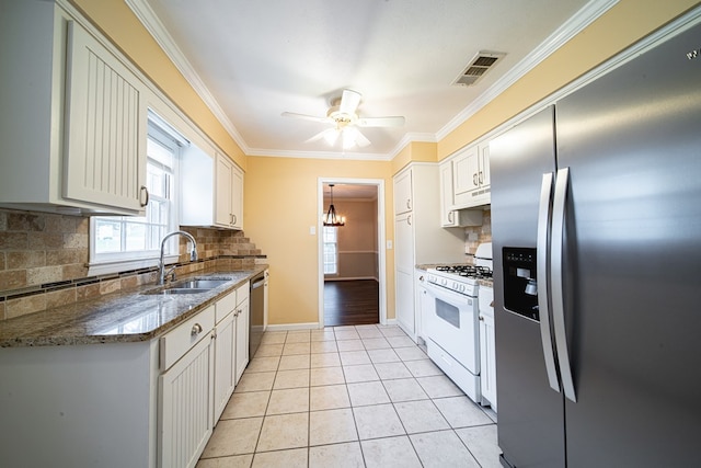 kitchen with visible vents, crown molding, appliances with stainless steel finishes, light tile patterned flooring, and a sink