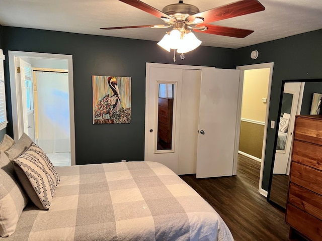 bedroom with ceiling fan and dark wood-style flooring