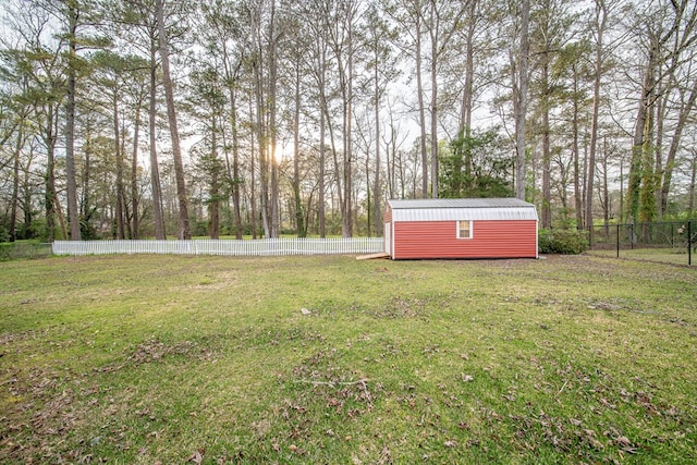 view of yard with a fenced backyard, a storage shed, and an outdoor structure