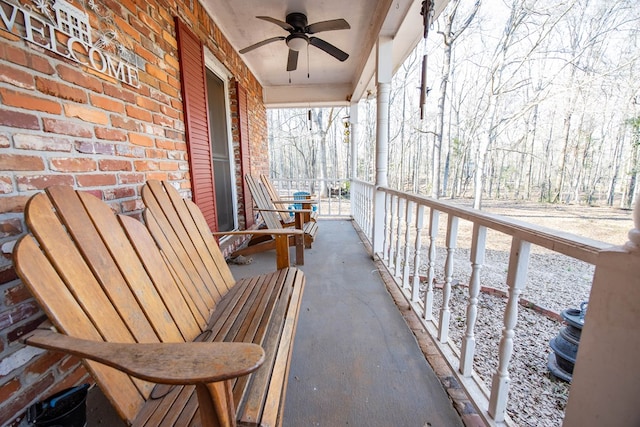 balcony featuring a ceiling fan and covered porch