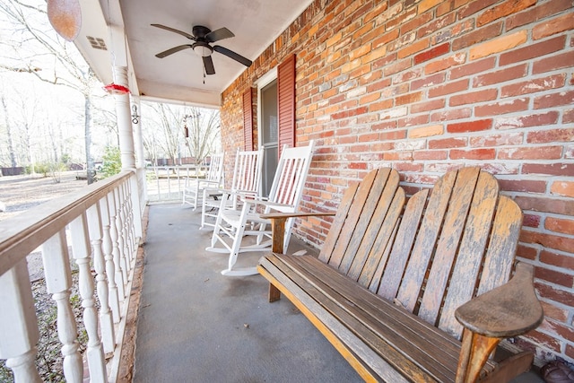 balcony with a porch and a ceiling fan