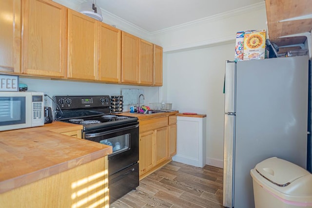 kitchen featuring wood counters, crown molding, black electric range, light hardwood / wood-style floors, and stainless steel refrigerator