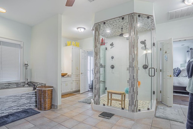 bathroom with tile patterned floors, vanity, ceiling fan, and shower with separate bathtub