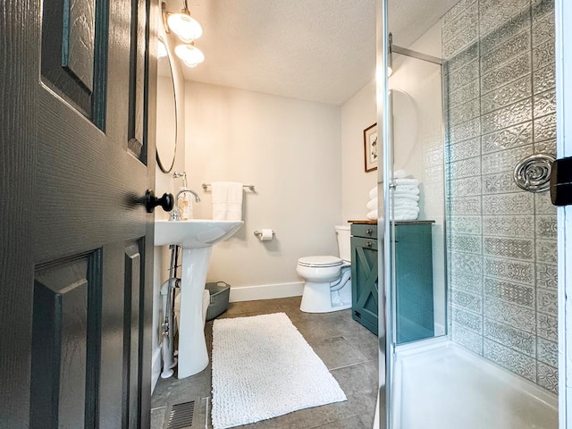 bathroom featuring walk in shower, tile patterned floors, and toilet