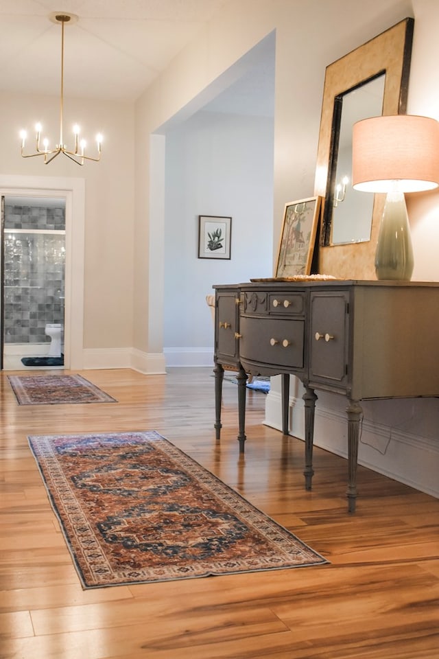 interior space with hardwood / wood-style floors and a notable chandelier