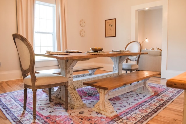 dining area featuring hardwood / wood-style flooring