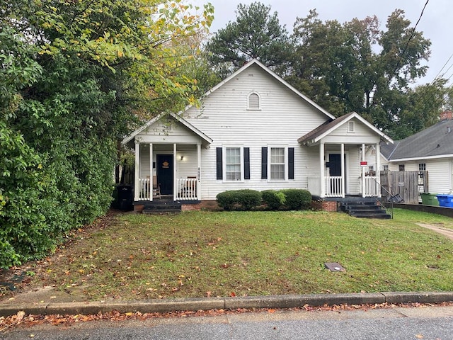 bungalow-style house featuring a front lawn