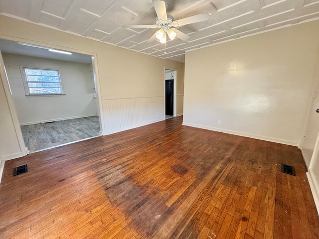 empty room featuring hardwood / wood-style flooring and ceiling fan