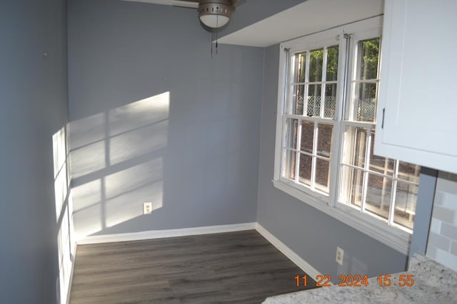 unfurnished room with dark hardwood / wood-style floors