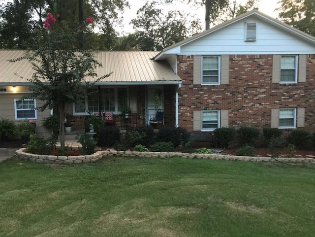 split level home featuring a front lawn and a porch