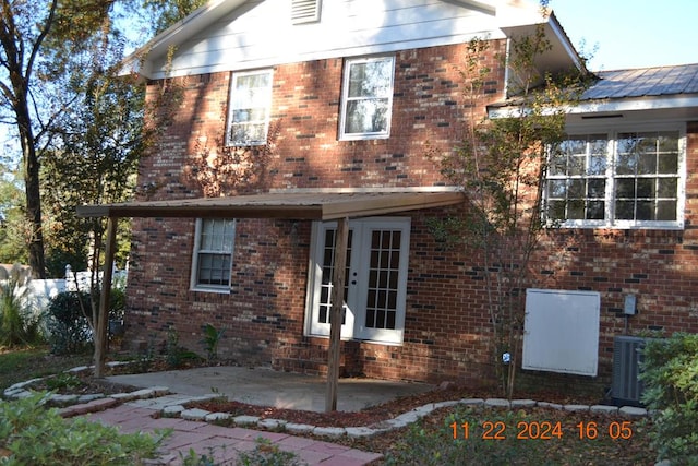 back of house with a patio area and french doors