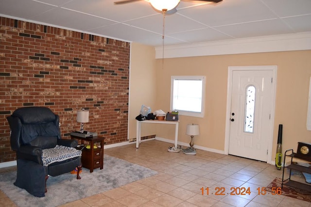 tiled entrance foyer featuring brick wall