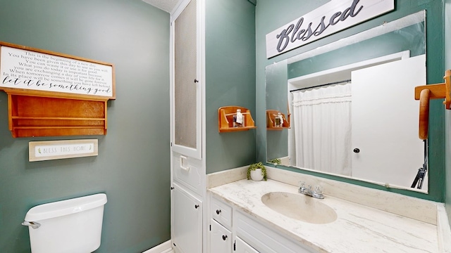 full bath featuring toilet and vanity