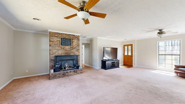 unfurnished living room with ornamental molding, carpet flooring, a fireplace, a textured ceiling, and a ceiling fan